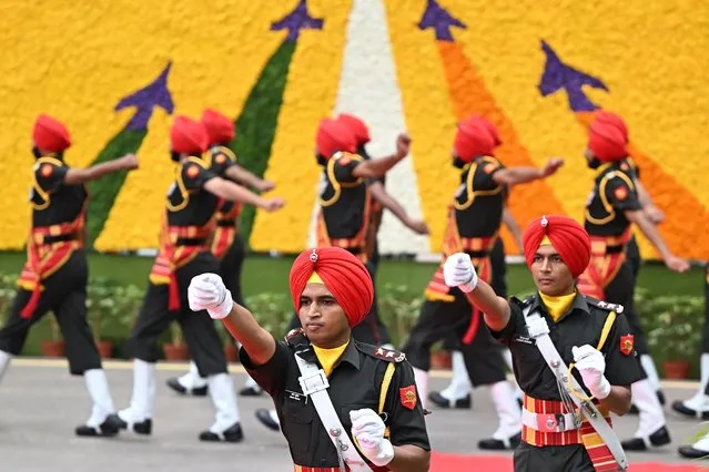 Indian soldiers prepare for the guard of honour before the arrival of India's Prime Minister Narendra Modi at the Red Fort during the celebrations to mark the country's 77th Independence Day in New Delhi on August 15, 2023. (Photo by Sajjad Hussain/AFP Photo)