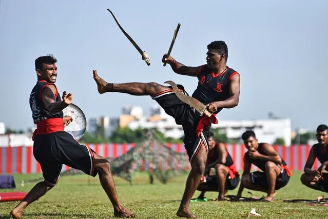 Indian army training cadets perform “Kalaripayattu”, an ancient martial art from Kerala, during a combined display ahead of their graduation ceremony, at the Officers Training Academy (OTA), in Chennai, India on September 8, 2023. A combined display of training proficiency was organized at the OTA as a prelude to a passing-out parade of cadets. The combined display marks the culmination of the adventure training and showcases the skills and expertise of armed forces display teams. (Photo by Idrees Mohammed/EPA/EFE)