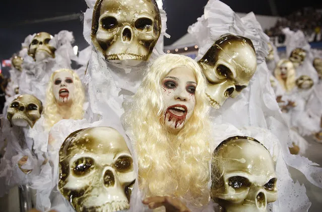 Dancers from the Gavioes da Fiel samba school perform during a carnival parade in Sao Paulo, Brazil, Saturday, February 6, 2016. (Photo by Andre Penner/AP Photo)