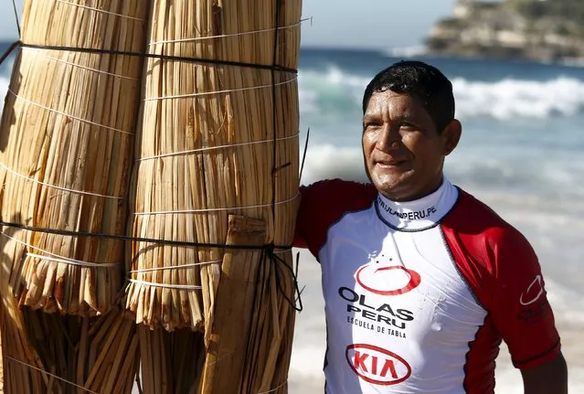 Peruvian surfer Carlos “Huevito” Areola stands alongside his hand-made reed board, or “caballito” (little horse), following a surf at Sydney's Bondi Beach, February 24, 2016. (Photo by Jason Reed/Reuters)