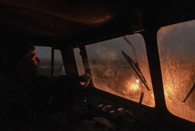 A Ukrainian servicemen drives along a frontline in Zaporizhzhia area, Ukraine, 18 December 2023. Russian troops entered Ukrainian territory in February 2022, starting a conflict that has provoked destruction and a humanitarian crisis. (Photo by Yakiv Liashenko/EPA/EFE)