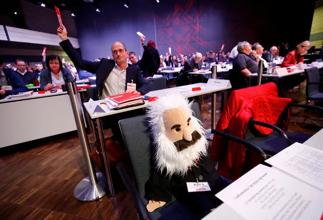 A Karl Marx puppet is placed on a seat while delegates of a three day party congress of Germany's left-wing party Die Linke vote in Bonn, Germany February 22, 2019. (Photo by Wolfgang Rattay/Reuters)