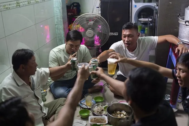 Local residents toast with beer as they gather for karaoke in Ho Chi Minh City, Vietnam, January 11, 2024. (Photo by Jae C. Hong/AP Photo)