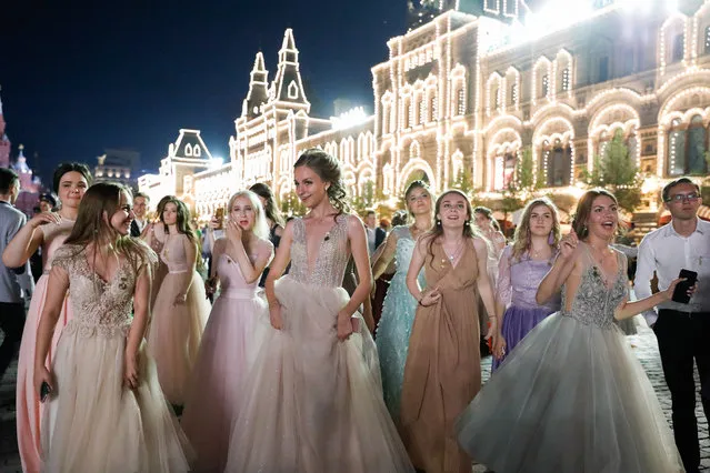 School leavers celebrate their graduation in Moscow's Red Square in Moscow, Russia on June 20, 2019. (Photo by Artyom Geodakyan/TASS)