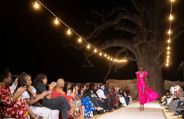 A model presents a creation by Adama Paris during the 19th annual Dakar Fashion Week at the Baobad forest, Mbour, Senegal, December 18 2021. (Photo by Zohra Bensemra/Reuters)
