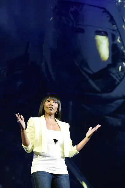 Cast member Angela Bassett addresses the audience during the "Tom Clancy's Rainbow Six Siege" game segment at Ubisoft's E3 2015 Conference at the Orpheum Theatre on Monday, June 15, 2015, in Los Angeles. (Photo by Chris Pizzello/Invision/AP)