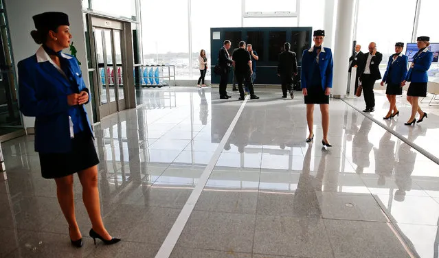 Stewardesses wait inside the new satellite facility for Munich Airport's Terminal 2 before the official opening ceremony, southern Germany, April 22, 2016. (Photo by Michael Dalder/Reuters)