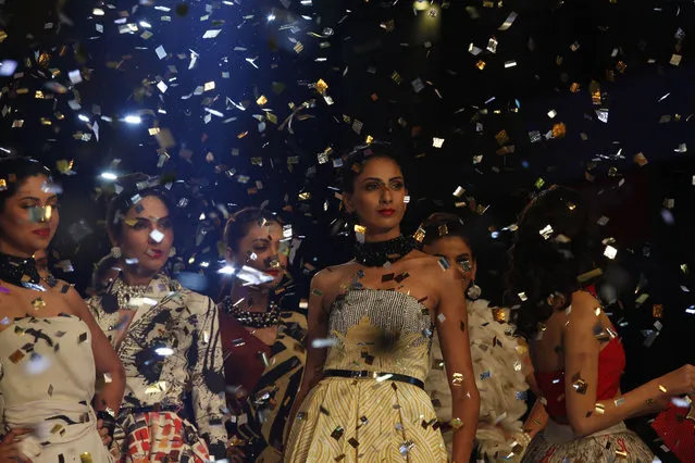 Models present creations by designer Deepak Parwani on the 2nd day of the PFDC Sunsilk Fashion Week in Lahore April 11, 2014. (Photo by Mohsin Raza/Reuters)