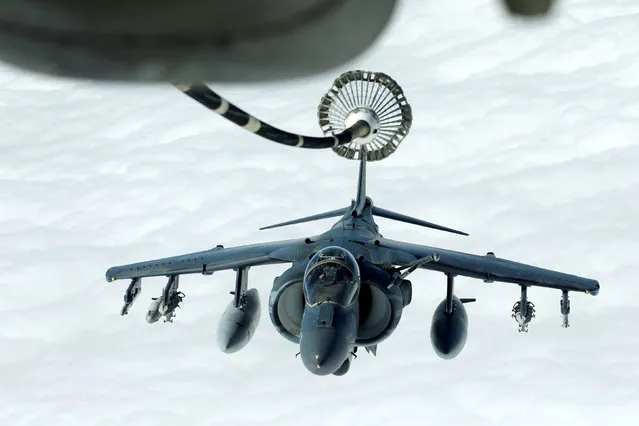 A US Marines Harrier AV-8B makes its way to a fueling boom suspended from a US Air Force KC-10 Extender during mid-air refueling support to Operation Inherent Resolve over Iraq and Syria air space, March 15, 2017. (Photo by Hamad I Mohammed/Reuters)