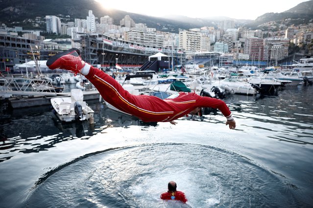 Ferrari's Charles Leclerc jumps into the marina after winning the F1 Monaco Grand Prix in Monaco on May 26, 2024. (Photo by Benoit Tessier/Reuters)