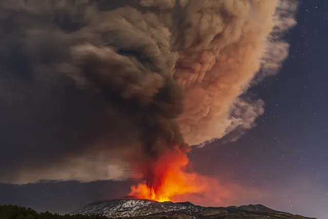 Smoke billows from the Mt. Etna volcano, as seen from Nicolosi, Sicily, southern Italy, Thursday, February 10, 2022. (Photo by Salvatore Allegra/AP Photo)