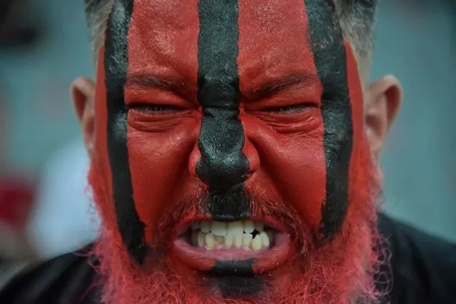 A fan of Athletico Paranaense is seen on the stands during the CONMEBOL Recopa all-Brazilian football match between Athletico Paranaense and Palmeiras at the Arena da Baixada stadium in Curitiba, Brazil, on February 23, 2022. (Photo by Nelson Almeida/AFP Photo)