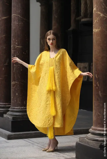 Model Bianca Gavrilas wears a a hand-embroidered cape made from the silk of the Golden Orb Spider in the V&A Museum's Medieval and Renaissance Gallery