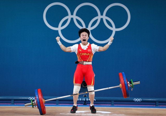 Hou Zhihui of Team China celebrates breaking the Olympic record during the Weightlifting - Women's 49kg on day twelve of the Paris 2024 Olympic Games at South Paris Arena on August 7, 2024 in Paris, France. (Photo by Amanda Perobelli/Reuters)