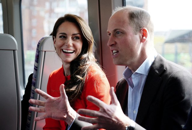 Britain's Prince William, Prince of Wales and Britain's Catherine, Princess of Wales take the Elizabeth line and speak with passengers in the tube on their wat to visit the Dog & Duck Pub in Soho, central London, on May 4, 2023 to hear about their preparation for the Coronation Weekend and meet members of staff and representatives from other hospitality and recreation businesses of the area. (Photo by Jordan Pettitt/Pool via AFP Photo)