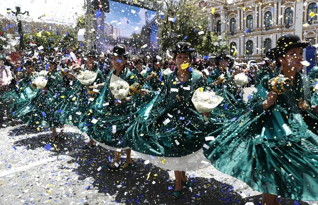 Dancers perform the “Morenada” during a parade in honor of “Jesus del Gran Poder”, or Jesus of Great Power in La Paz, Bolivia, Saturday, December 14, 2019. Devotees celebrating the local cultural events' inclusion into the UNESCO world heritage list take to the streets of La Paz to celebrate the “Jesus of the Great Power” annual religious festival. (Photo by Juan Karita/AP Photo)