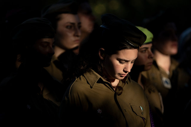 Female soldiers attend the funeral for Israeli Defense Forces paramedic Sgt. Agam Naim, the first woman Israeli Defense Forces soldier killed in combat in the Gaza Strip, in Kibbutz Mishmarot, Israel, Wednesday, Israel, September 18, 2024. (Photo by Maya Alleruzzo/AP Photo)