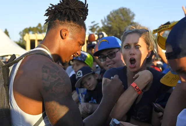 Los Angeles Chargers' Rayshawn Jenkins signs autographs during a joint NFL football practice between the Chargers and the Los Angeles Rams, Wednesday, August 9, 2017, in Irvine, Calif. (Photo by Mark J. Terrill/AP Photo)