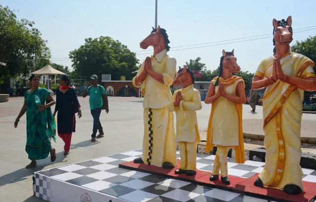 Pedestrians walk past the mascot, Thambi, displayed near Marina beach  on the inaugural day of the 44th Chess Olympiad in Chennai, India, Thursday, July 28, 2022. The Olympiad will run from July 28 to Aug. 10 at Poonjeri village in Mamallapuram. (Photo by AP Photo/Stringer)