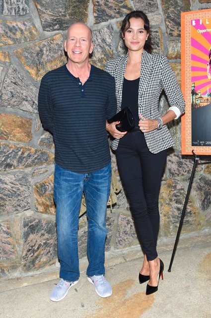 Actor Bruce Willis, left, and Emma Heming-Willis arrive at the Hamptons Sneak Screening of Open Road Films' “Rock the Kasbah” on Friday, August 28, 2015 in East Hampton, N.Y. (Photo by Scott Roth/Invision for Open Road Films/AP Images)