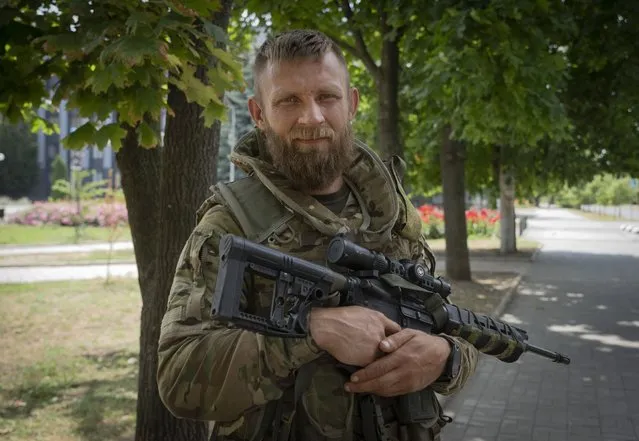 Ukrainian soldier Artem looks on during an interview to the Associated Press in Bakhmut, Donetsk region, Ukraine, Sunday, June 26, 2022. (Photo by Efrem Lukatsky/AP Photo)