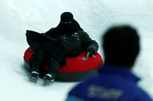 A veiled Saudi woman enjoys a ride in the new Snow City at Al Othaim Mall in Riyadh, Saudi Arabia July 26, 2016. (Photo by Faisal Al Nasser/Reuters)