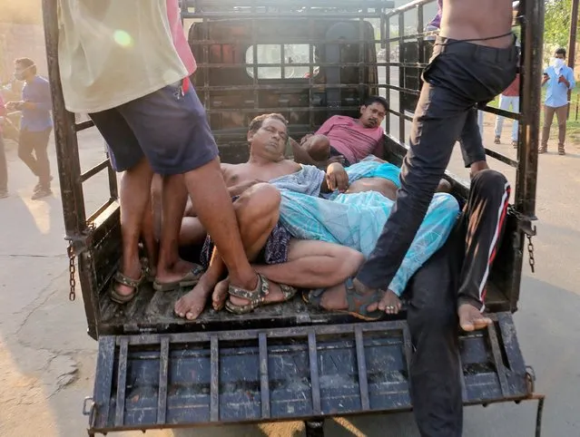 People affected by a gas leak at the LG Polymers Plant are transported in a vehicle in Visakhapatnam, India, May 7, 2020. At least 11 people were killed in a gas leak at a plant operated by LG Polymers, a unit of South Korea's biggest petrochemical maker, LG Chem, making polystyrene products that made hundreds of people sick and led to the evacuation of villagers living nearby, officials said. (Photo by R. Narendra/Reuters)