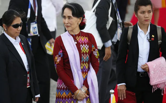 Myanmar leader Aung San Suu Kyi waits for her limousine after arriving at Clark International Airport, north of Manila, Philippines Saturday, November 11, 2017. Suu Kyi is one of more than a dozen leaders to attend the 31st ASEAN Summit and Related Summits in Manila. (Photo by Bullit Marquez/AP Photo)