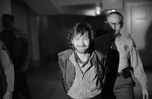 A smiling Charles Manson goes to lunch after an outbreak in court that resulted in his ejection, along with three women co-defendants, from the Tate murder trial on December 21, 1970. The outburst started after Leslie Van Houten said she wanted to fire her new lawyer, a replacement for missing Ronald Hughes, and hire a woman attorney. Before she was ejected to an adjoining room with the others, Ms. Van Houten slapped a bailiff and told the judge, “I'd strike you if I could”. (Photo by George Brich/AP Photo)