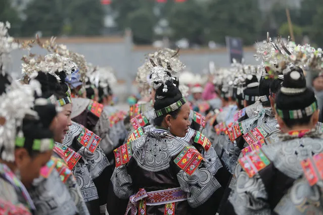 Women of Miao ethnic group present their costumes in celebration of a traditional folk festival in Danzhai County of Qiandongnan Miao and Dong Autonomous Prefecture, southwest China's Guizhou Province, December 2, 2017. ( Photo by Zhang Hui/Xinhua/Barcroft Images)