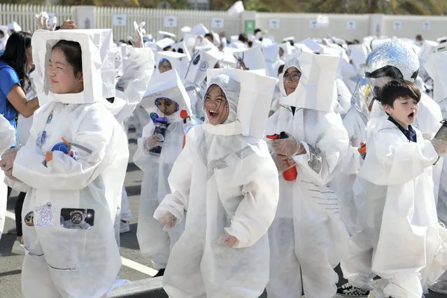 Children cheers once the announcement is made about Guinness World Record for Largest Gathering of People Dressed as Astronauts broken with 940 students at the Repton – Fry Campus Abu Dhabi, Al Reem Island on October 25, 2022. (Photo by Khushnum Bhandari/The National)