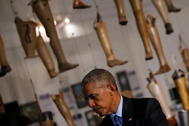 Prosthetic legs form a museum installation as U.S. President Barack Obama visits the Cooperative Orthotic and Prosthetic Enterprise (COPE) for victims of amputations due to accidents with the many rounds of unexploded ordnance remaining in the Laotian countryside following the Vietnam War era, on the sidelines of the ASEAN Summit, in Vientiane, Laos September 7, 2016. (Photo by Jonathan Ernst/Reuters)