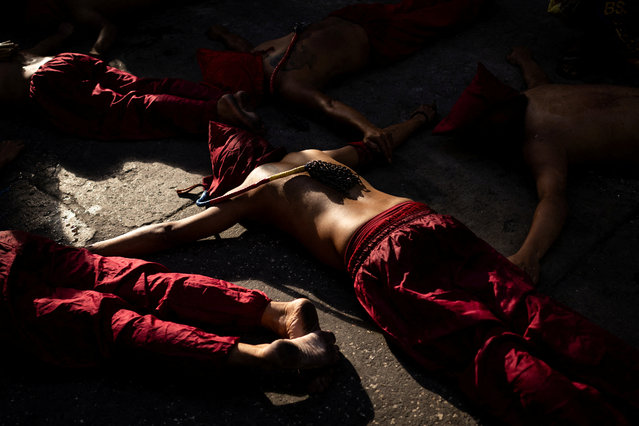 Filipino penitents lie on the ground while performing self-flagellation on Maundy Thursday in Mandaluyong City, Metro Manila, Philippines on April 16, 2025. (Photo by Eloisa Lopez/Reuters)