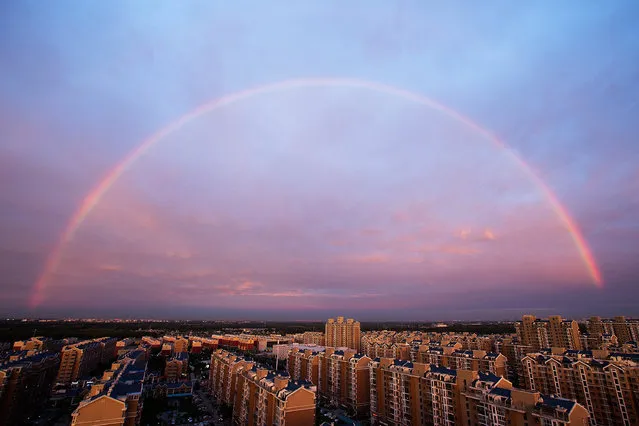 A rainbow appears over the city on August 3, 2015 in Beijing, China. (Photo by Lintao Zhang/Getty Images)