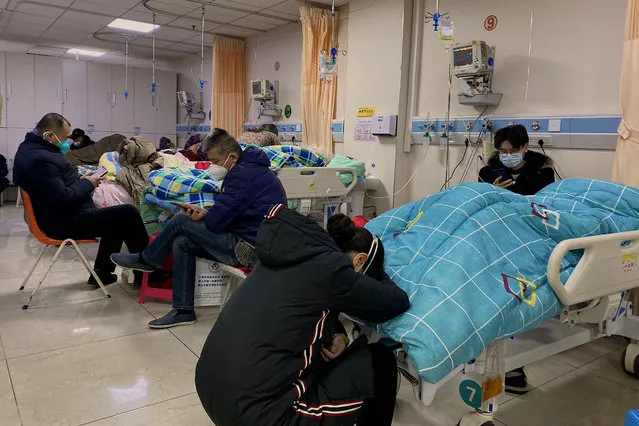 Patients with Covid-19 lay in beds at Tangshan Gongren Hospital in China's northeastern city of Tangshan on December 30, 2022. (Photo by Noel Celis/AFP Photo)