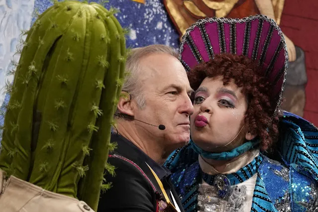 American actor, comedian and filmmaker Bob Odenkirk is kissed during a roast while being honored as Man of the Year by Harvard University's Hasty Pudding Theatricals, Thursday, February 2, 2023, in Cambridge, Mass. (Photo by Charles Krupa/AP Photo)