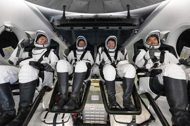 Roscosmos cosmonaut Kirill Peskov, left, NASA astronauts Nichole Ayers, Anne McClain, and JAXA (Japan Aerospace Exploration Agency) astronaut Takuya Onishi are seen inside the SpaceX Dragon Endurance spacecraft onboard the SpaceX recovery ship SHANNON shortly after having landed in the Pacific Ocean on August 9, 2025 off the coast of San Diego, California. McClain, Ayers, Onishi, and Peskov are returning after seven months in space as part of Expedition 73 aboard the International Space Station. (Photo by Keegan Barber/NASA via Getty Images)