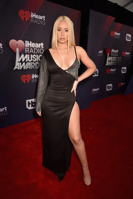 Iggy Azalea arrives at the 2018 iHeartRadio Music Awards which broadcasted live on TBS, TNT, and truTV at The Forum on March 11, 2018 in Inglewood, California. (Photo by Jeff Kravitz/Getty Images for iHeartMedia)