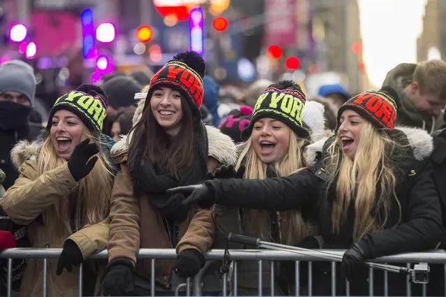 Revelers cheer in Times Square during New Year's Eve celebrations in New York December 31, 2014. (Photo by Keith Bedford/Reuters)