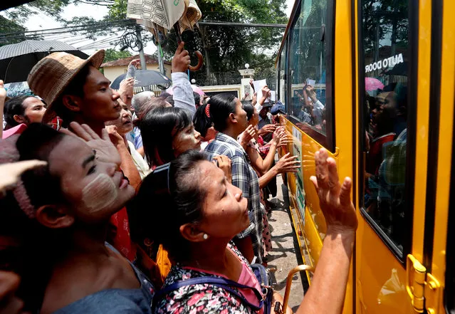 Relatives and friends of prisoners gather around a bus carrying inmates upon their release from Insein prison in Yangon, Myanmar, 17 April 2023. Myanmar's Military Junta granted amnesty to over 3,000 prisoners all over the country on 17 April, to mark the Buddhist New Year. (Photo by Nyein Chan Naing/EPA/EFE)