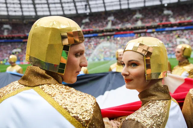 Fans pose before the Russia 2018 World Cup Group A football match between Russia and Saudi Arabia at the Luzhniki Stadium in Moscow on June 14, 2018. (Photo by Sergei Boblev/TASS via Getty Images)