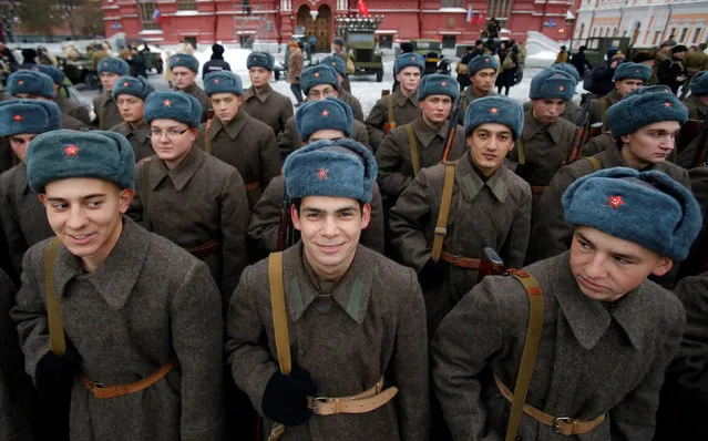 Servicemen dressed in historical uniforms wait before a military parade marking the anniversary of the 1941 parade when Soviet soldiers marched towards the front lines of World War Two, in Red Square in Moscow, Russia, November 7, 2016. (Photo by Maxim Shemetov/Reuters)