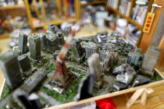 A miniature model of street scenes created by Taiwanese artist Hank Cheng is seen at his workshop in New Taipei City, Taiwan on June 17, 2018. While some of the vehicles used in Cheng's street scenes are bought in shops, all the buildings and small details like the magazines and the furniture for his model houses are created from scratch. (Photo by Tyrone Siu/Reuters)