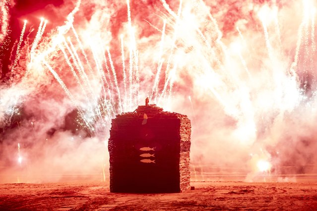 Fireworks precede the annual bonfire on Scheveningen North Beach, near the Hague in the Netherlands on December 30, 2024, which was lit a day early this year because of forecast bad weather. (Photo by Hollandse Hoogte/Rex Features/Shutterstock)