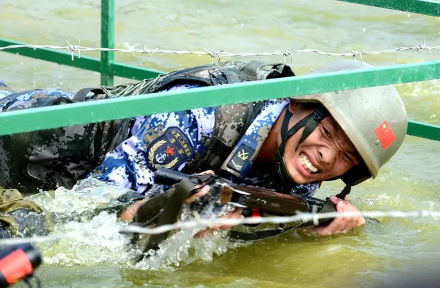 A Chinese team member competes in the survival trail event of the International Army Games 2018 “Seaborne Assault” on August 2, 2018 in Quanzhou, Fujian Province of China. (Photo by Wang Dongming/China News Service/VCG via Getty Images)