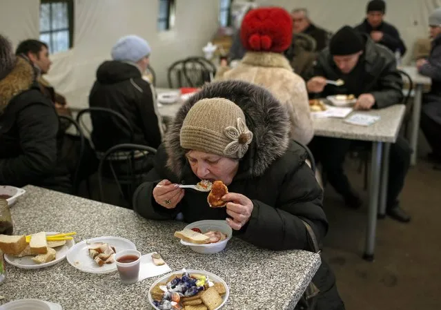 Refugees from eastern Ukraine have a free meal in a volunteer centre near a railway station in Slaviansk February 9, 2015. (Photo by Gleb Garanich/Reuters)