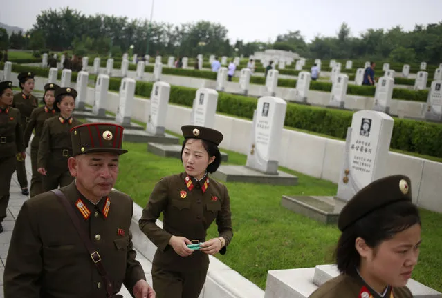 North Korean soldiers visit Fatherland Liberation War Martyrs Cemetery during the commemoration of the 65th anniversary of the ceasefire armistice that ends the fighting in the Korean War, which the country celebrates as the day of “victory in the fatherland liberation war” in Pyongyang, North Korea, Friday, July 27, 2018. (Photo by Dita Alangkara/AP Photo)