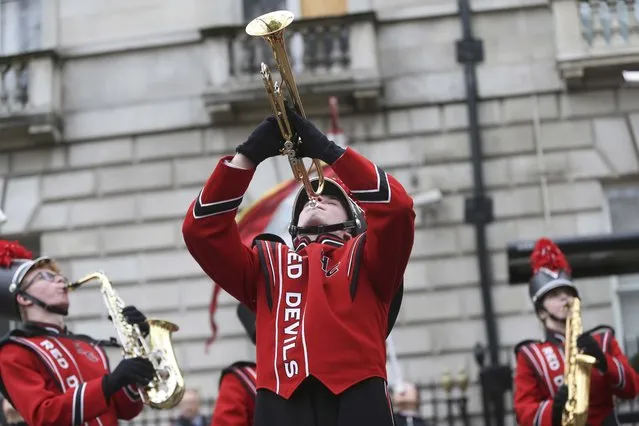 Members of the Hinsdale Central High School Red Devil marching band take part in the New Year's Day Parade in London, Britain January 1, 2016. (Photo by Neil Hall/Reuters)