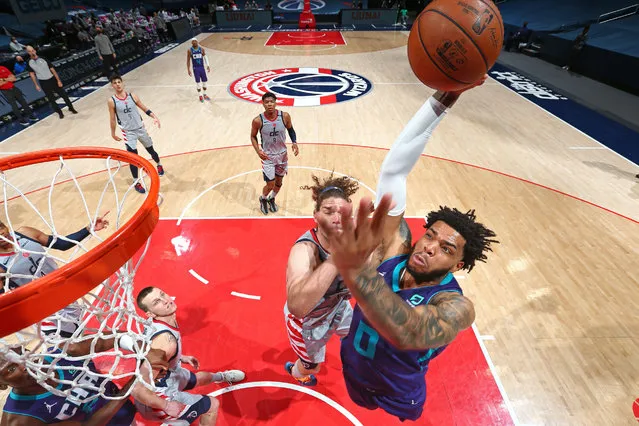 Miles Bridges #0 of the Charlotte Hornets dunks the ball against the Washington Wizards on March 30, 2021 at Capital One Arena in Washington, DC. (Photo by Stephen Gosling/NBAE via Getty Images)