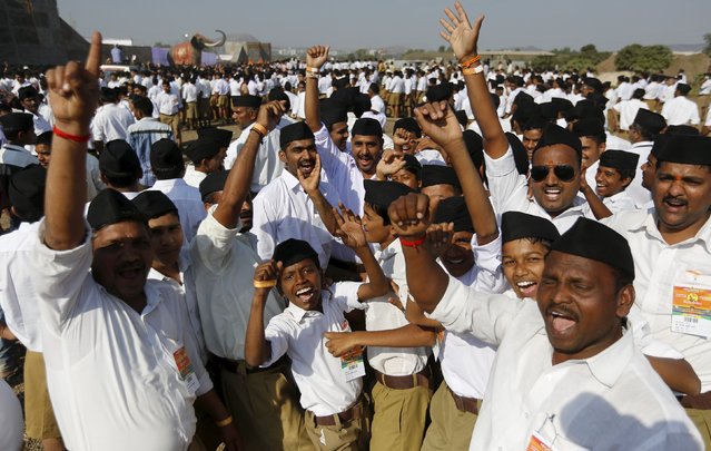 Volunteers of the Hindu nationalist organisation Rashtriya Swayamsevak Sangh (RSS) shout religious slogans as they arrive to attend a conclave on the outskirts of Pune, India, January 3, 2016. (Photo by Danish Siddiqui/Reuters)